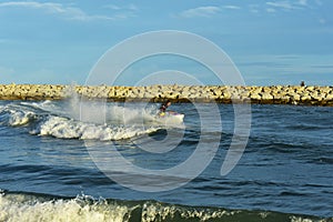 A man riding a water scooter Summer vacation in the tropical sea The hobby of a young man riding the sea