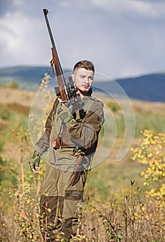 Man with rifle hunting equipment nature background. What you should have while hunting nature environment. Recharge