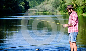 Man at riverside enjoy idyllic landscape while fishing. Fishing cause negative physiological effects for fish