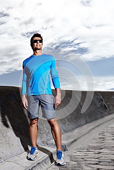 Man, road and ready for run in outdoors, confident and athlete for performance training. Happy male person, full body