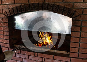 Man roasts barbecue near the stove