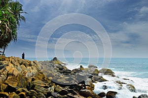 Man on a rocky shore