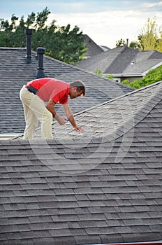 A man on a roof photo