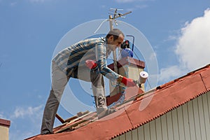 Man on the roof of painting