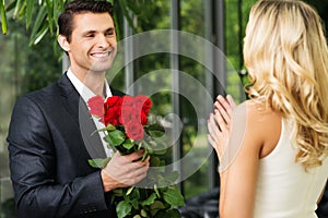 Man with roses dating his lady