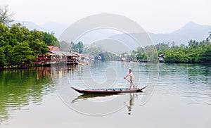 A man rowing boat at the village in Koh Chang, Thailand