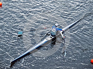 Man rowing in boat on water