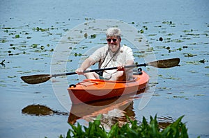 Man rowing a kayak