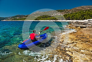 Man rowing in kayak at Adriatic sea