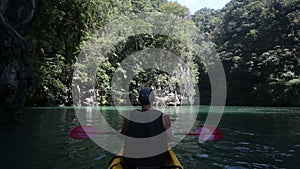 man rowing kayak in the lagoon