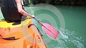 man rowing kayak and turn