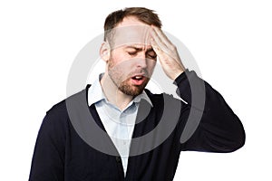 Man rubbing his throbbing forehead with his hand