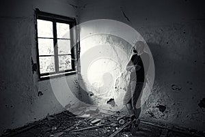 Man in ruined house