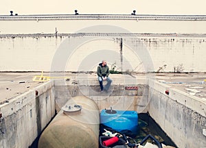 Man in the ruins of an industry