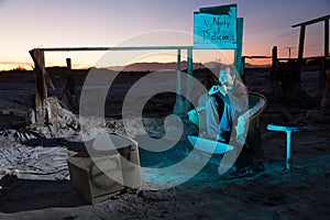 Man in Ruins Watching Television