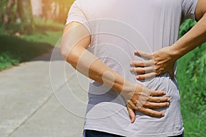 man runing with back pain photo