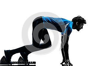 Man runner sprinter on starting blocks silhouette