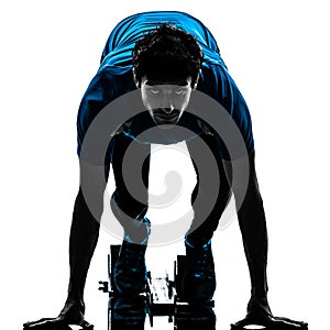 Man runner sprinter on starting blocks silhouette