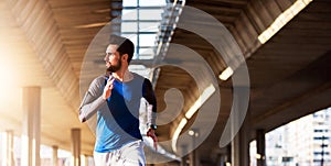 Man Runner Under Bridge in the City