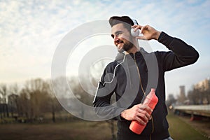 Man Runner Under Bridge in the City Taking Brake