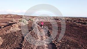 Man running alone through desert to nowhere in Tenerife, Canary Islands