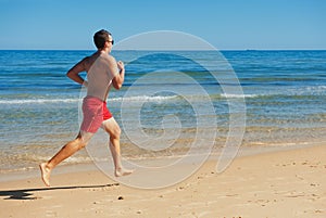 Man running along the coast