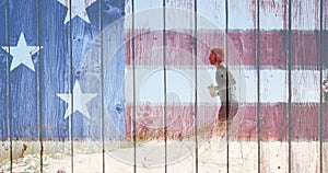 Man running with american flag made of wood