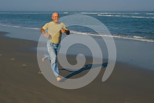 Man Running on the beach photo