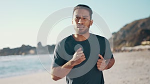 Man, running on beach and fitness with cardio outdoor, health and wellness, active and workout. Training for race