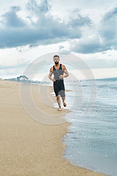 Man Running On Beach, Jogging During Outdoor Workout. Sports Con