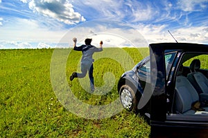 Man Running From Car In Open Field