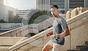 Man, running or city steps for fitness, heart health training or cardio workout in Brazilian urban location. Portrait