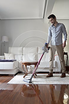 Man running a cordless vacuum