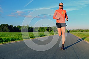 Man running on country road