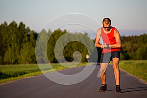 Man running on country road and training