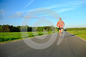 Man running on country road, training inspiration and motivation