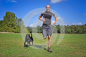 Man running with dog