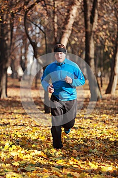 Man running in the forest photo