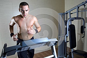 Man running at gym