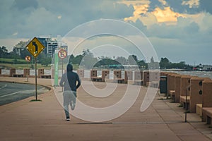 Man running at montevideo rambla, uruguay