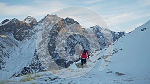 Man running at the mountain with snow