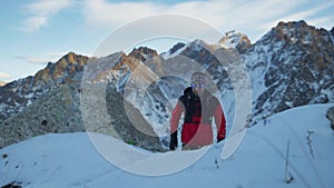 Man running at the mountain with snow