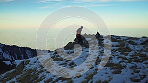 Man running at the mountain with snow