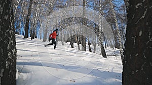 Man running at the mountain with snow
