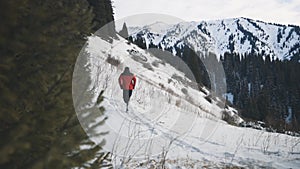 Man running at the mountain with snow