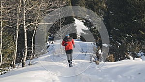 Man running at the mountain with snow