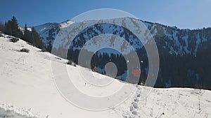 Man running at the mountain with snow