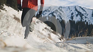 Man running at the mountain with snow