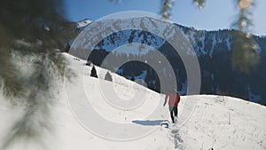 Man running at the mountain with snow