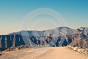 Man Running on Mountain Track